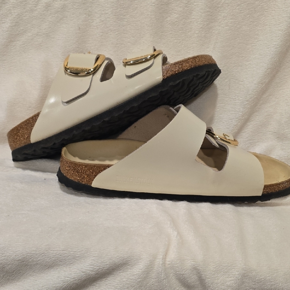 Birkenstock Cream Sandals with Adjustable Straps and Contoured Footbed
